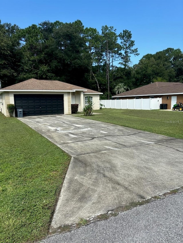 exterior space with a garage and a front yard