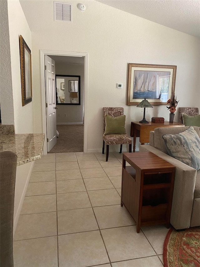 5900 NW 59th Ct, Ocala, FL 34482 - living room featuring light tile patterned floors and lofted ceiling