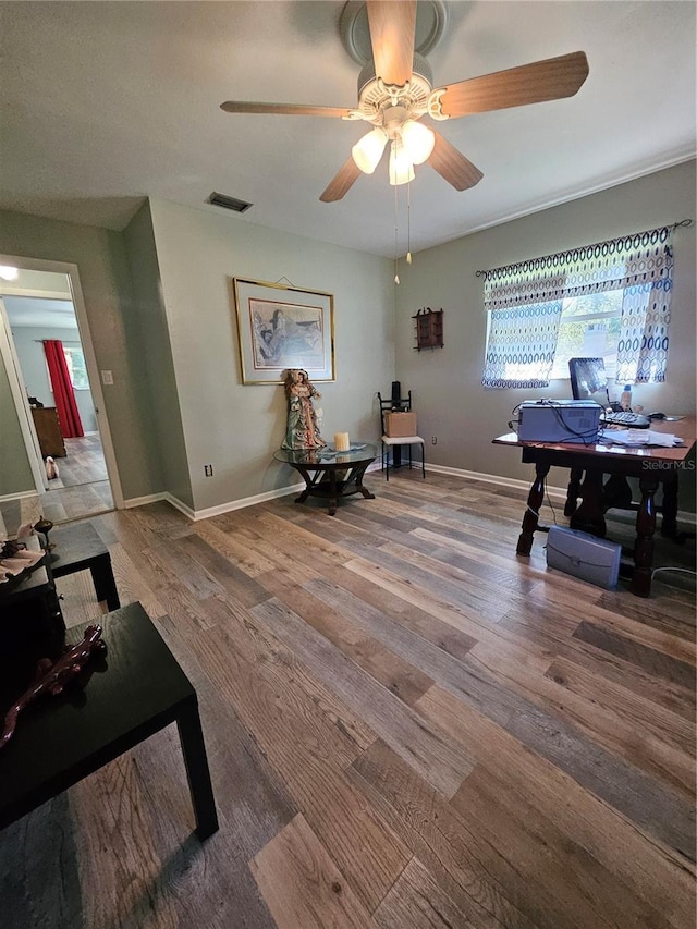 sitting room featuring ceiling fan and hardwood / wood-style floors