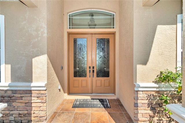 view of exterior entry featuring french doors