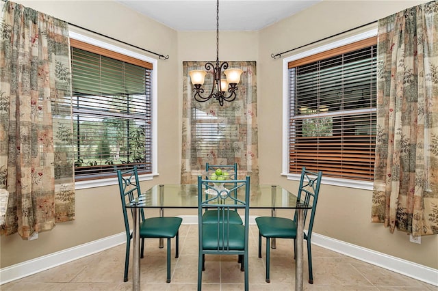 tiled dining area with a notable chandelier and plenty of natural light