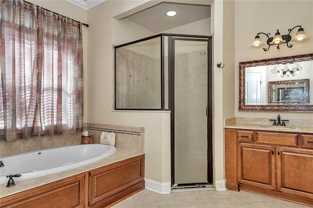 bathroom featuring vanity, crown molding, tile patterned floors, and shower with separate bathtub