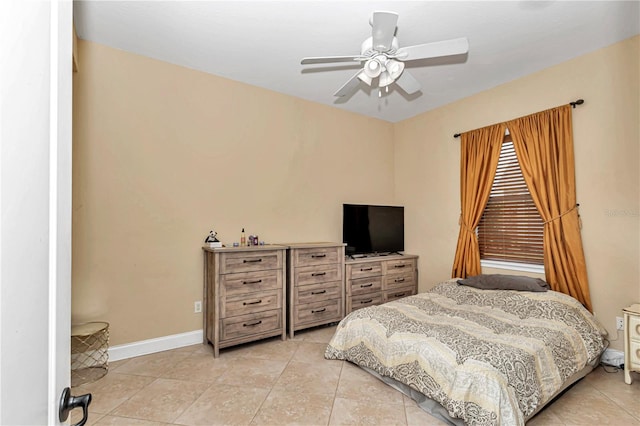 bedroom featuring light tile patterned floors and ceiling fan