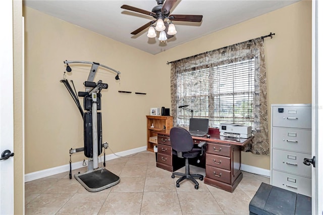 tiled home office featuring ceiling fan