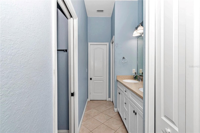 bathroom with vanity and tile patterned flooring