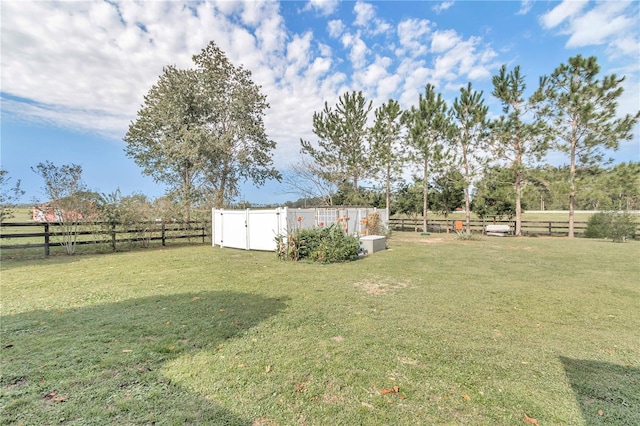 view of yard with a rural view