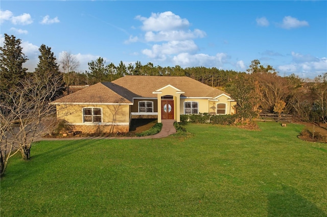 ranch-style house featuring a front yard