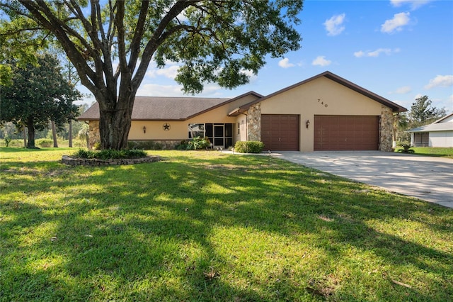 ranch-style home featuring a front yard and a garage