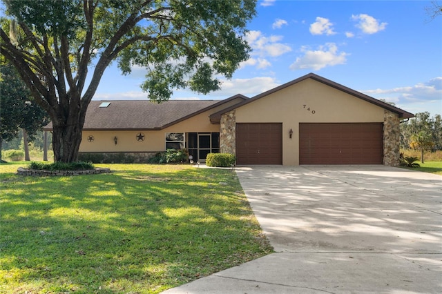 ranch-style home with a front yard and a garage