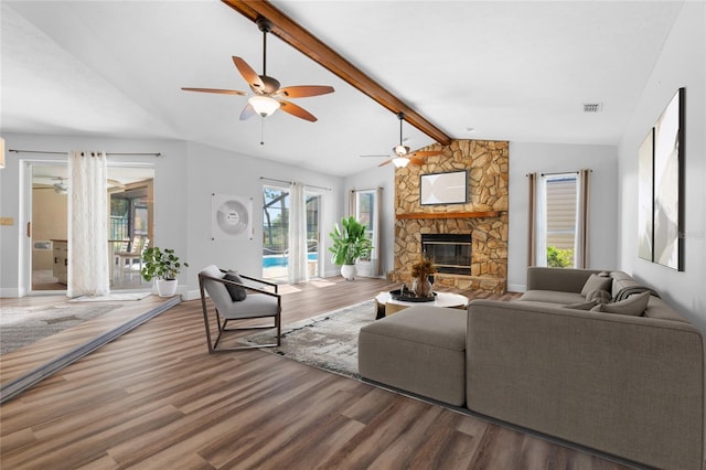 living room with vaulted ceiling with beams, plenty of natural light, and wood-type flooring