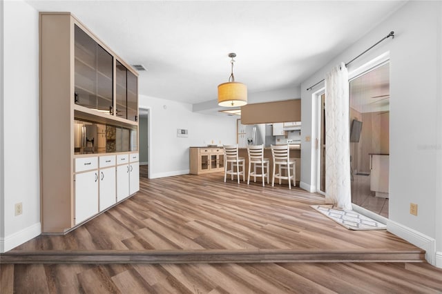 unfurnished dining area featuring light hardwood / wood-style floors