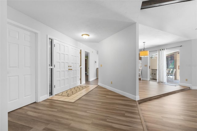 foyer entrance featuring a textured ceiling and hardwood / wood-style flooring