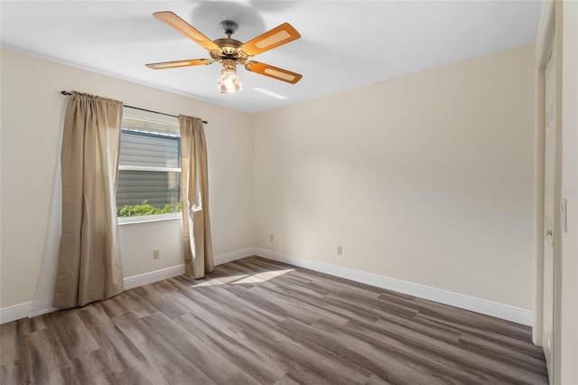 spare room featuring ceiling fan and hardwood / wood-style floors