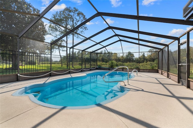 view of pool featuring a lanai and a patio