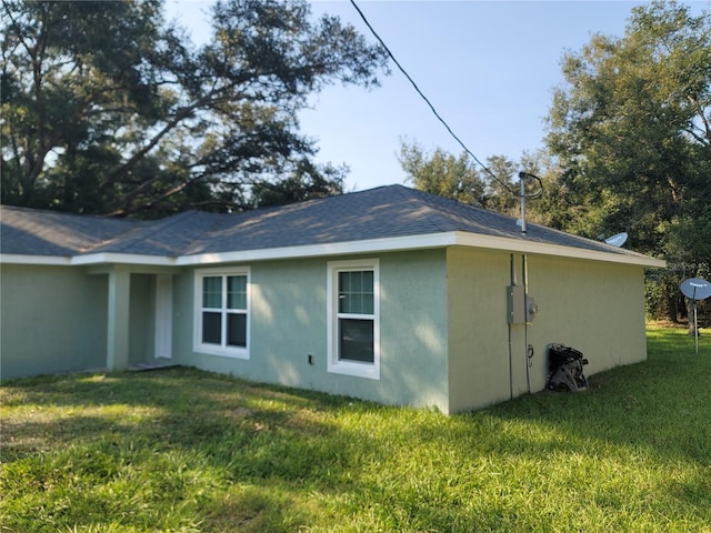 view of property exterior featuring a yard