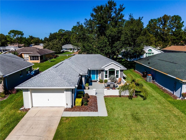 view of front facade featuring a front yard and a garage