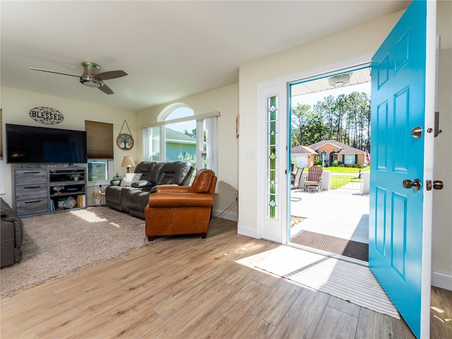 interior space with ceiling fan, light hardwood / wood-style floors, and a wealth of natural light