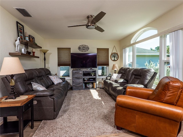 living room featuring ceiling fan and carpet floors