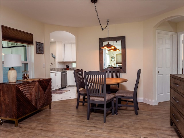 dining space with light wood-type flooring