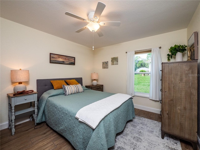 bedroom with ceiling fan and hardwood / wood-style flooring