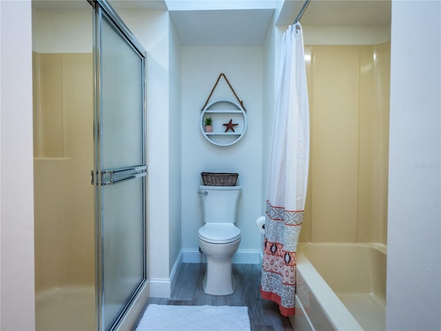 bathroom featuring hardwood / wood-style floors, shower with separate bathtub, and toilet