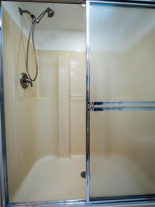 bathroom featuring walk in shower