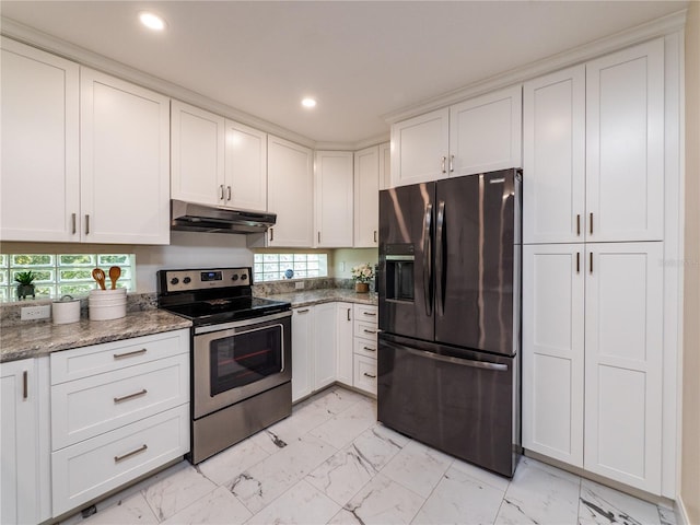 kitchen featuring white cabinets, stainless steel appliances, plenty of natural light, and stone counters