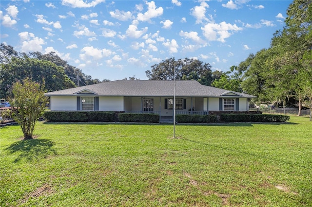 ranch-style house featuring a front yard