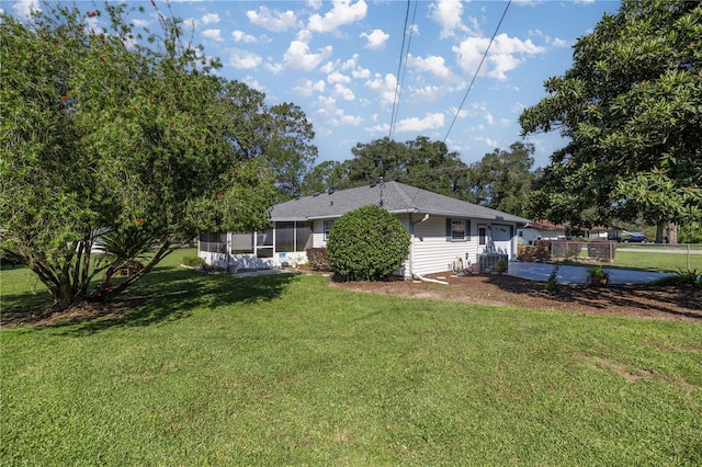 view of yard featuring a sunroom