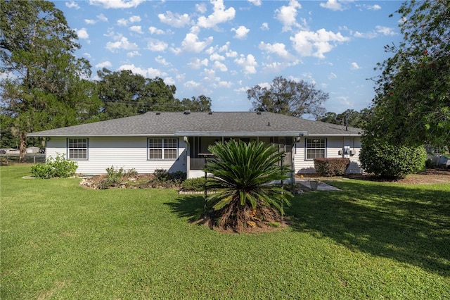 back of property featuring a yard