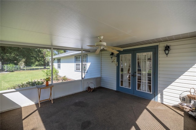 unfurnished sunroom with french doors