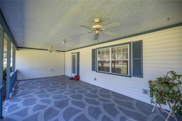 view of patio featuring ceiling fan