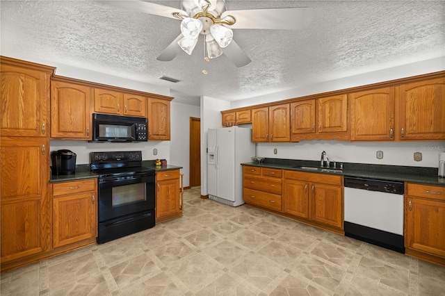 kitchen featuring ceiling fan, black appliances, sink, and a textured ceiling