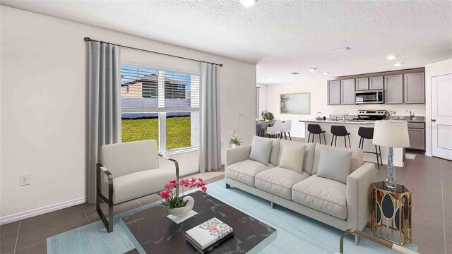 living room featuring a textured ceiling and dark tile patterned flooring