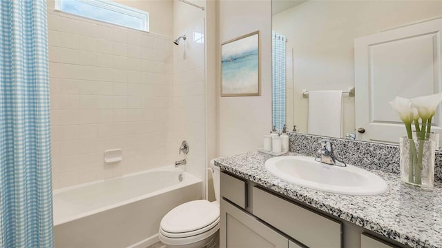 full bathroom featuring shower / bathtub combination with curtain, vanity, and toilet