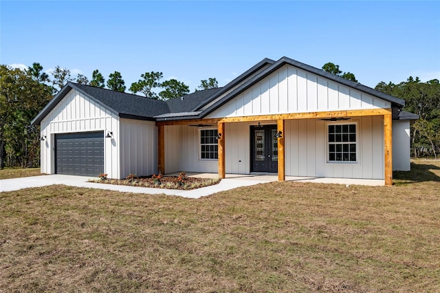 modern farmhouse style home with a garage, a porch, and a front yard