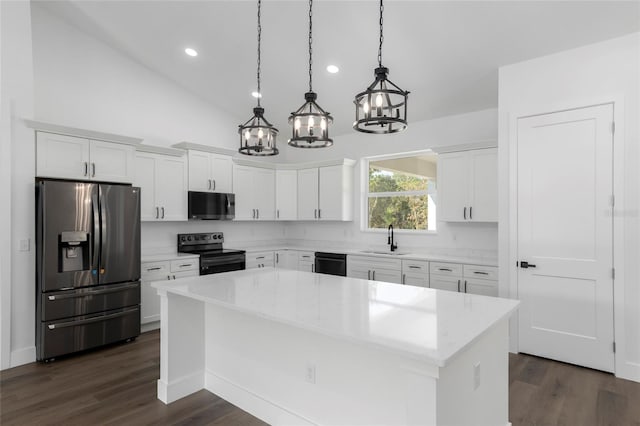 kitchen featuring white cabinetry, a kitchen island, black appliances, and vaulted ceiling