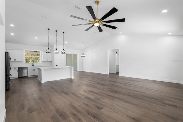 unfurnished living room with ceiling fan, sink, dark hardwood / wood-style floors, and lofted ceiling