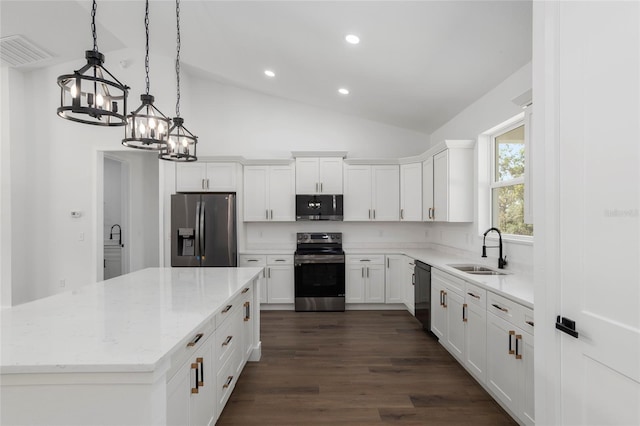 kitchen featuring appliances with stainless steel finishes, sink, white cabinets, dark hardwood / wood-style floors, and lofted ceiling