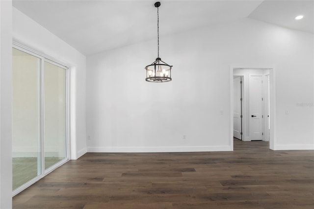 unfurnished dining area featuring dark hardwood / wood-style flooring, vaulted ceiling, and a notable chandelier