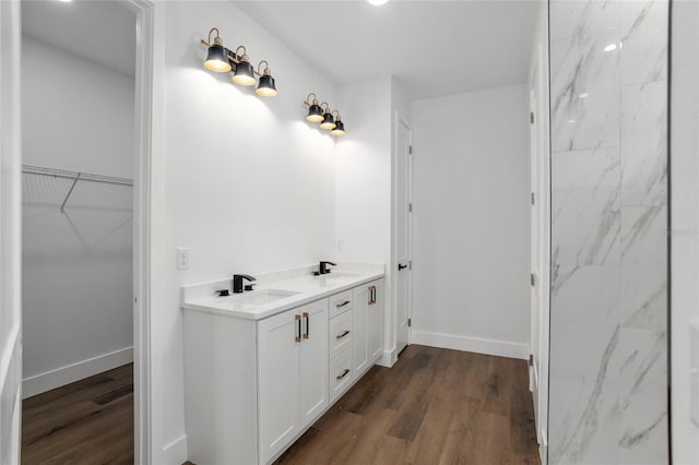 bathroom with vanity and wood-type flooring