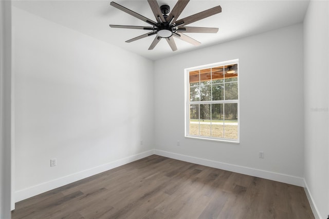 unfurnished room featuring ceiling fan and dark hardwood / wood-style flooring