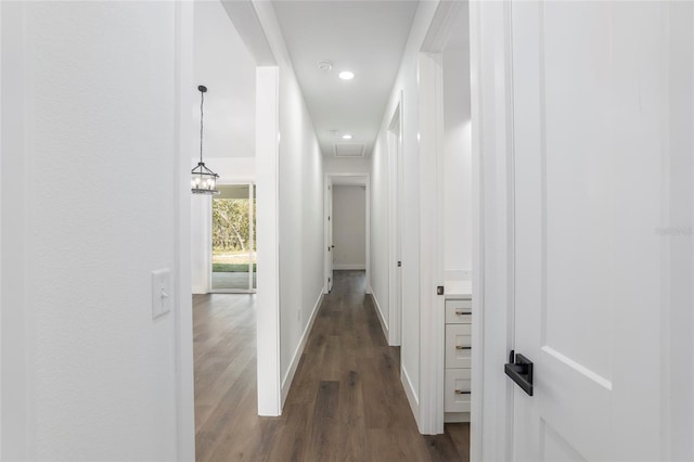 corridor featuring dark hardwood / wood-style flooring