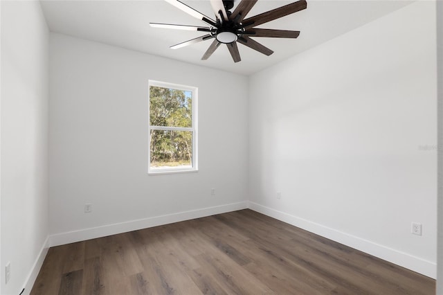 unfurnished room featuring dark hardwood / wood-style flooring and ceiling fan