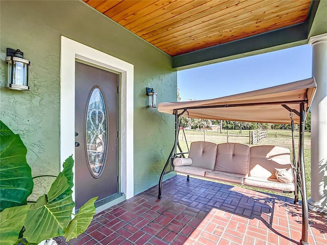 entrance to property with a patio area