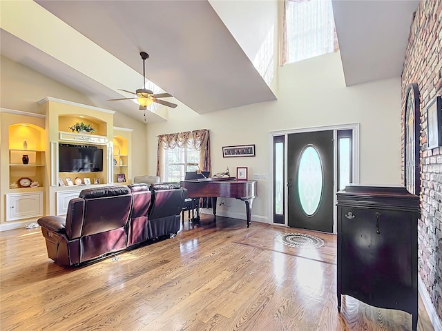 entryway featuring light hardwood / wood-style floors, lofted ceiling, and ceiling fan