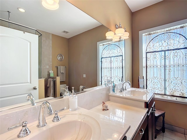 bathroom with vanity and tile patterned flooring