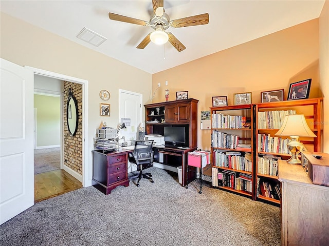 office area featuring dark carpet and ceiling fan