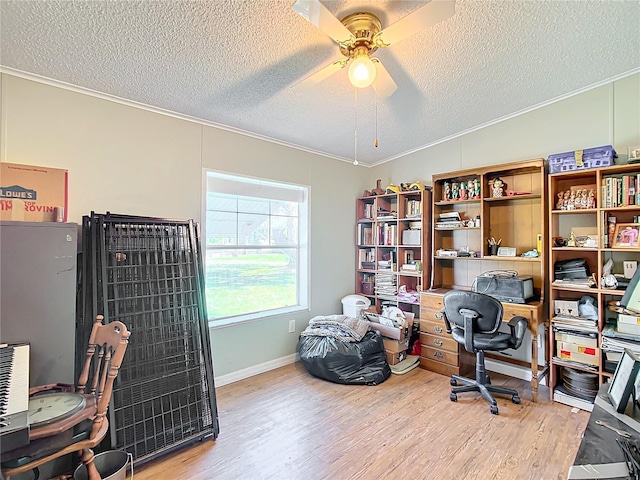 office featuring crown molding, wood-type flooring, a textured ceiling, and ceiling fan