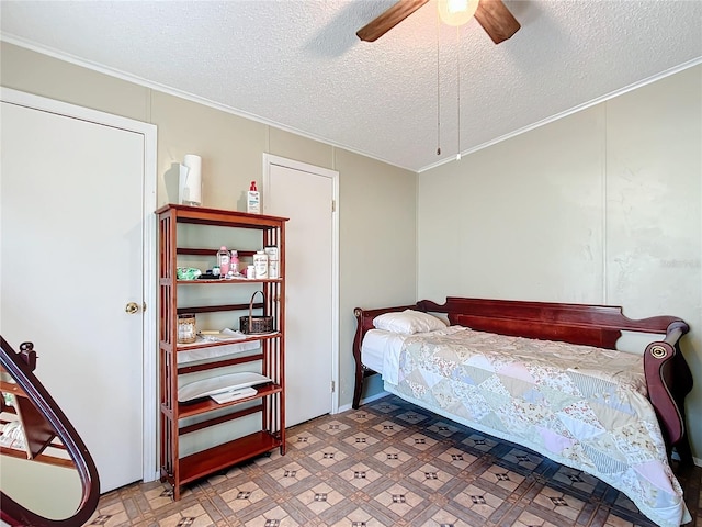 bedroom with ornamental molding, a textured ceiling, and ceiling fan